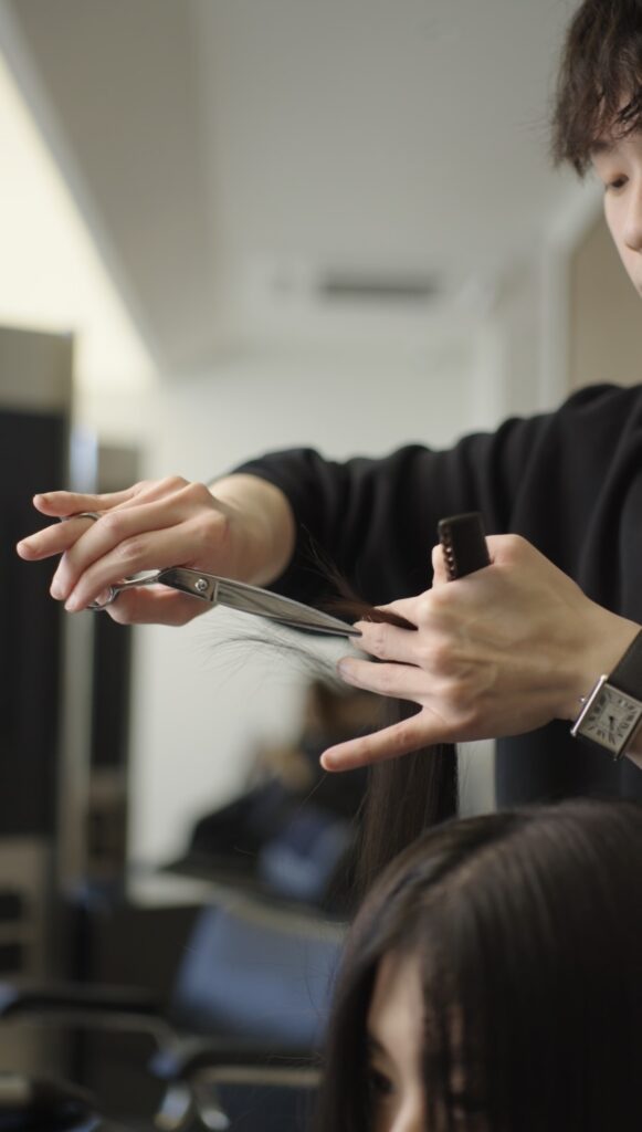 Haircut in progress at NŌMI Bukit Jalil